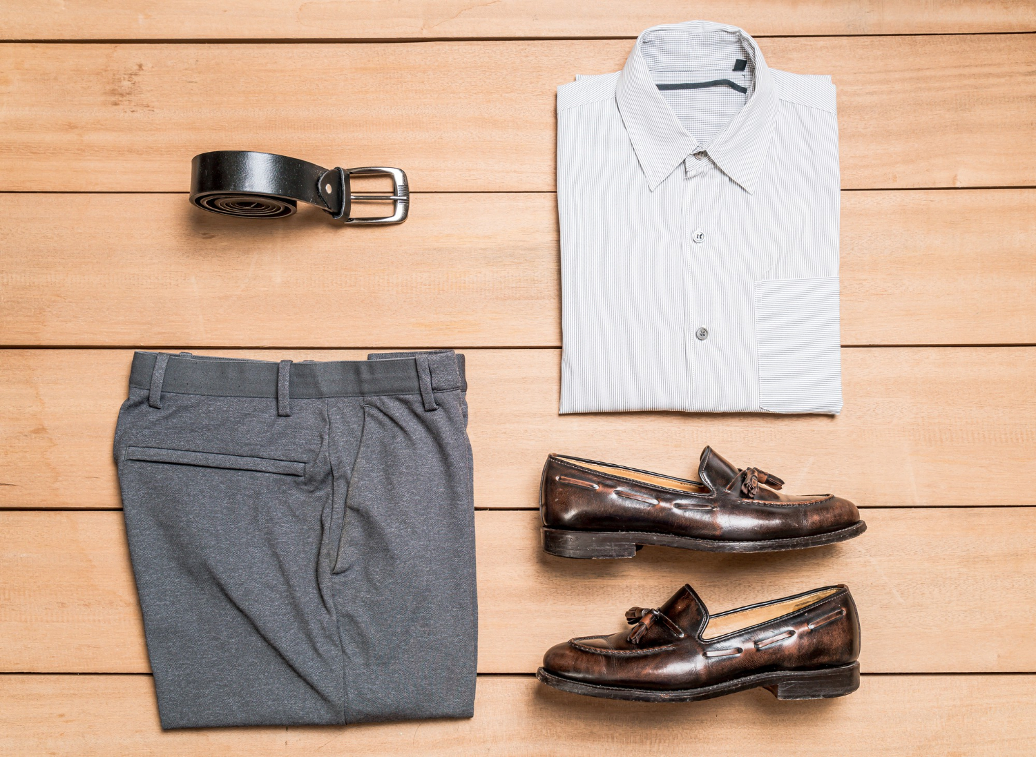 Set of casual clothes with white shirt, gray pants, brown shoes and belt