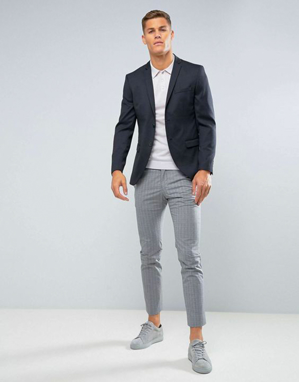 Black blazer, white polo, gray chinos, gray suede low-top sneakers outfit