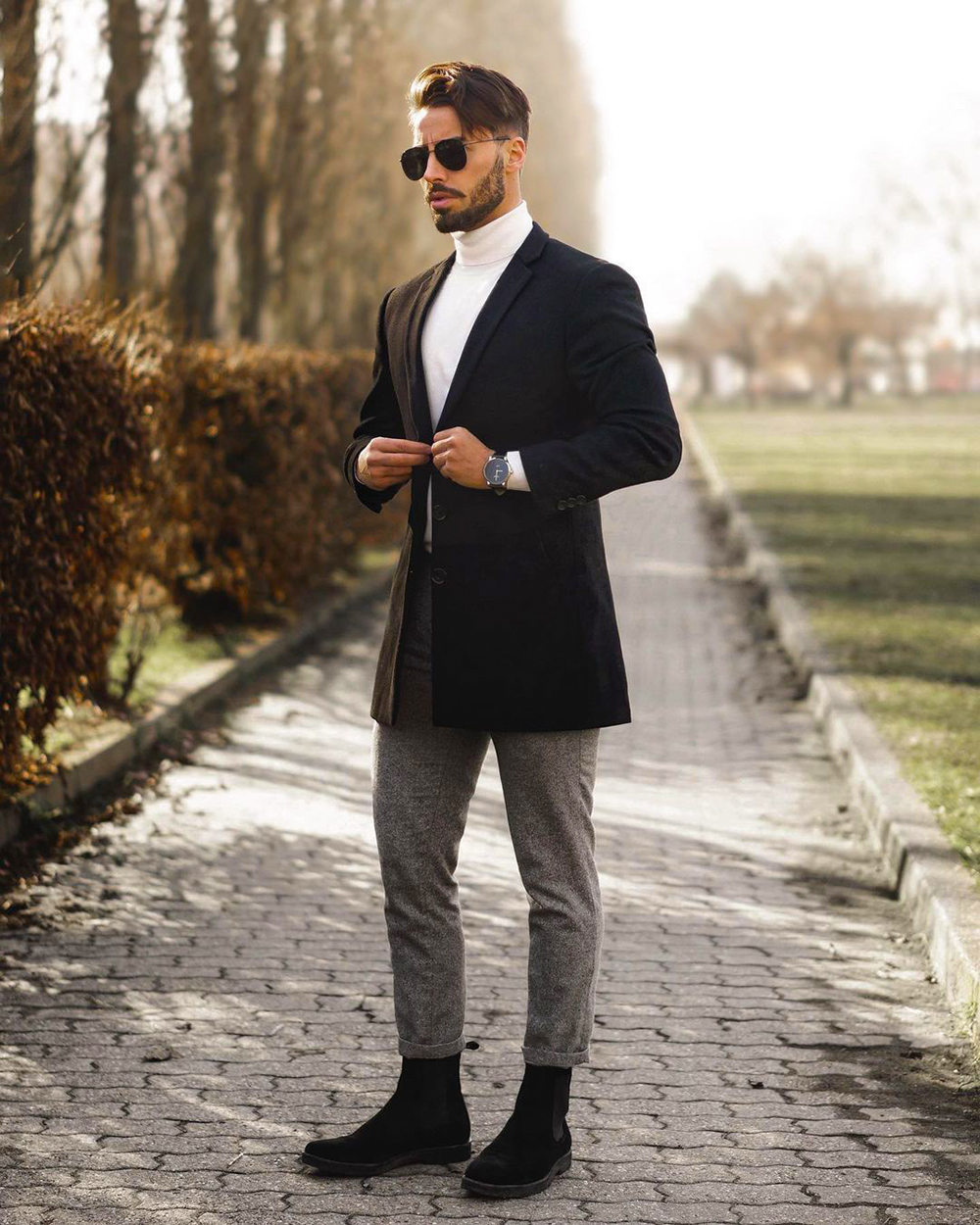 Black blazer, white turtleneck, gray chinos, black suede Chelsea boots outfit