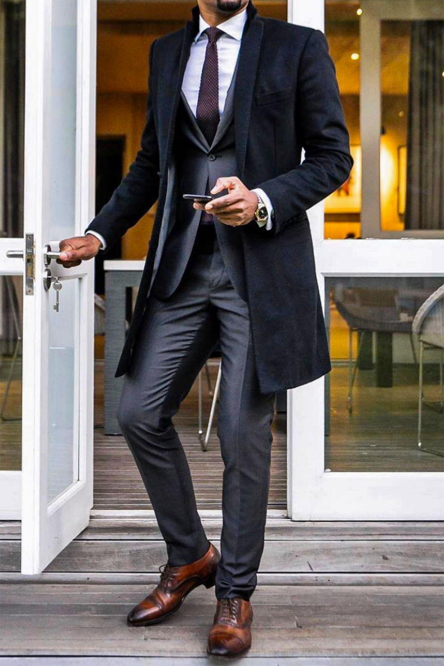 Black coat, charcoal suit, black tie, dark brown leather oxford shoes outfit