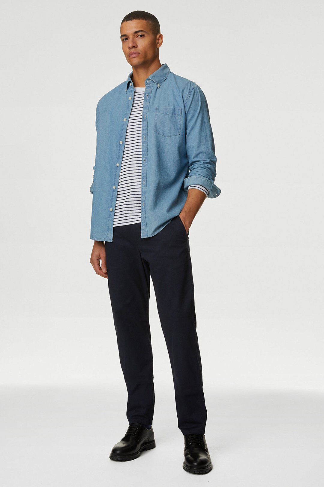 Blue denim shirt, white striped shirt, navy chinos, and black derby shoes outfit