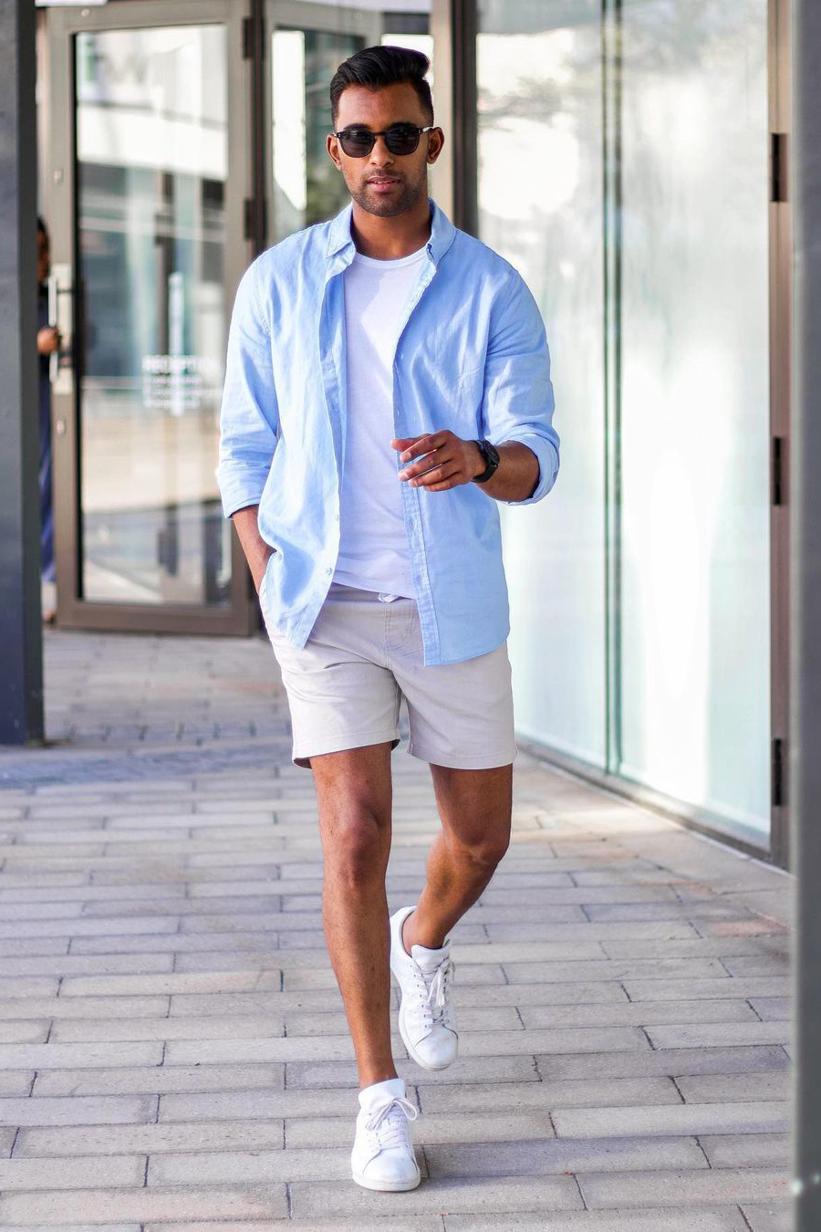 Blue long-sleeve shirt, white crew neck t-shirt, gray shorts, and white sneakers outfit