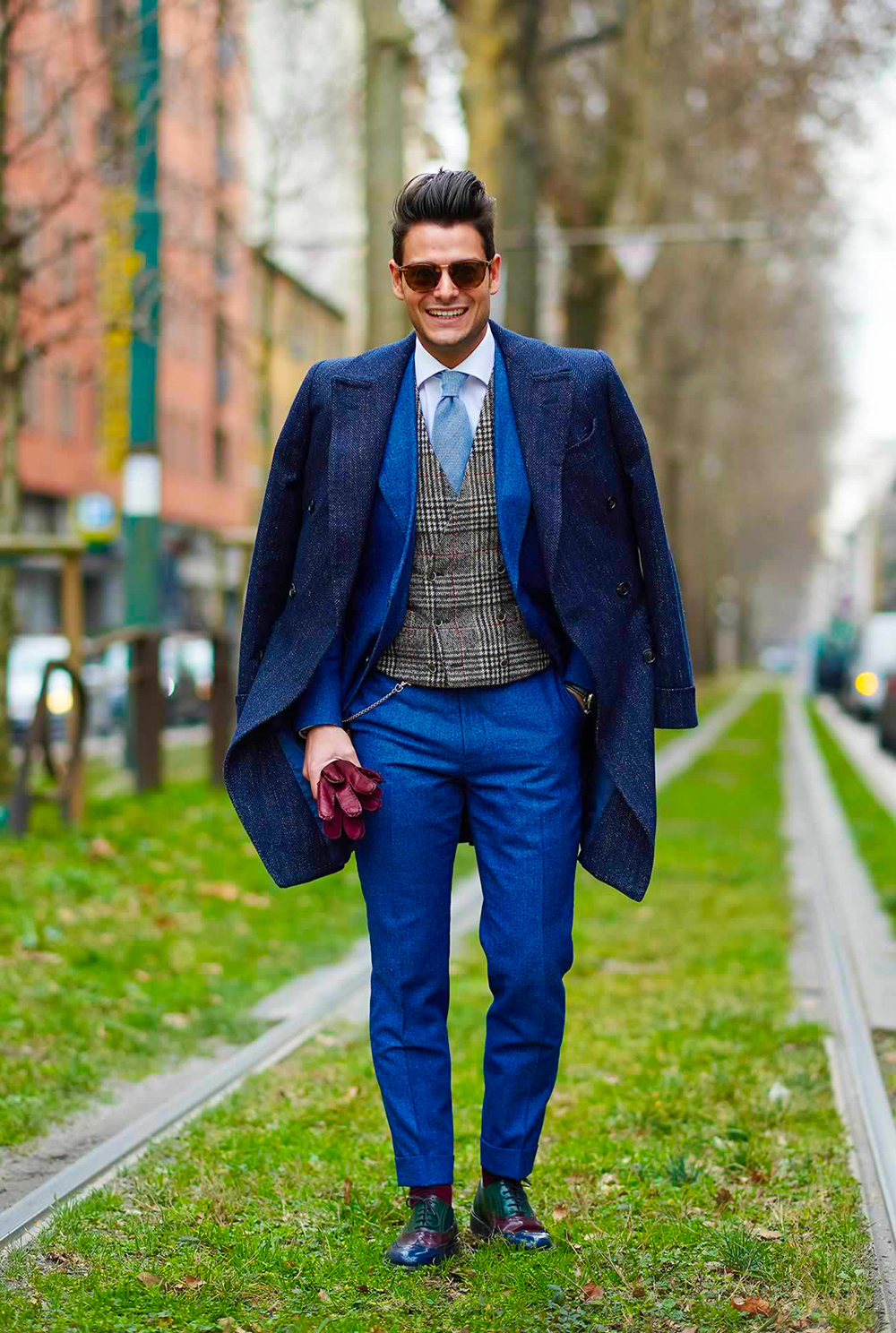 Blue suit, navy overcoat, waistcoat, and oxford shoes outfit