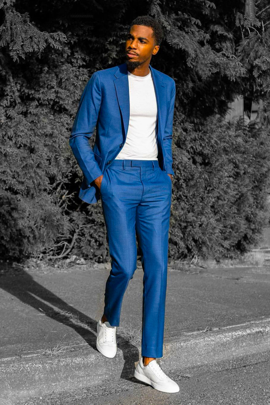 Blue suit, white crew neck t-shirt, and white low-top sneakers outfit