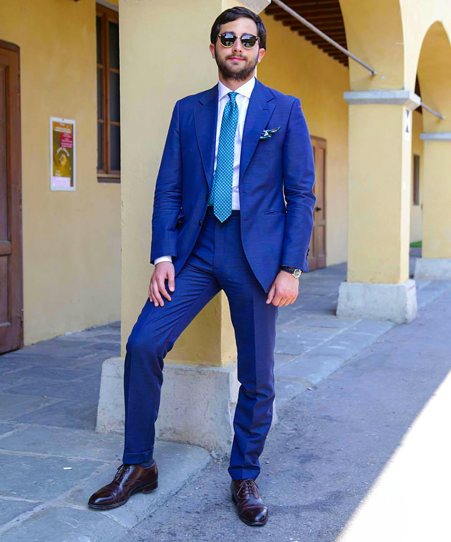 Blue suit, white dress shirt, and black oxford shoes outfit