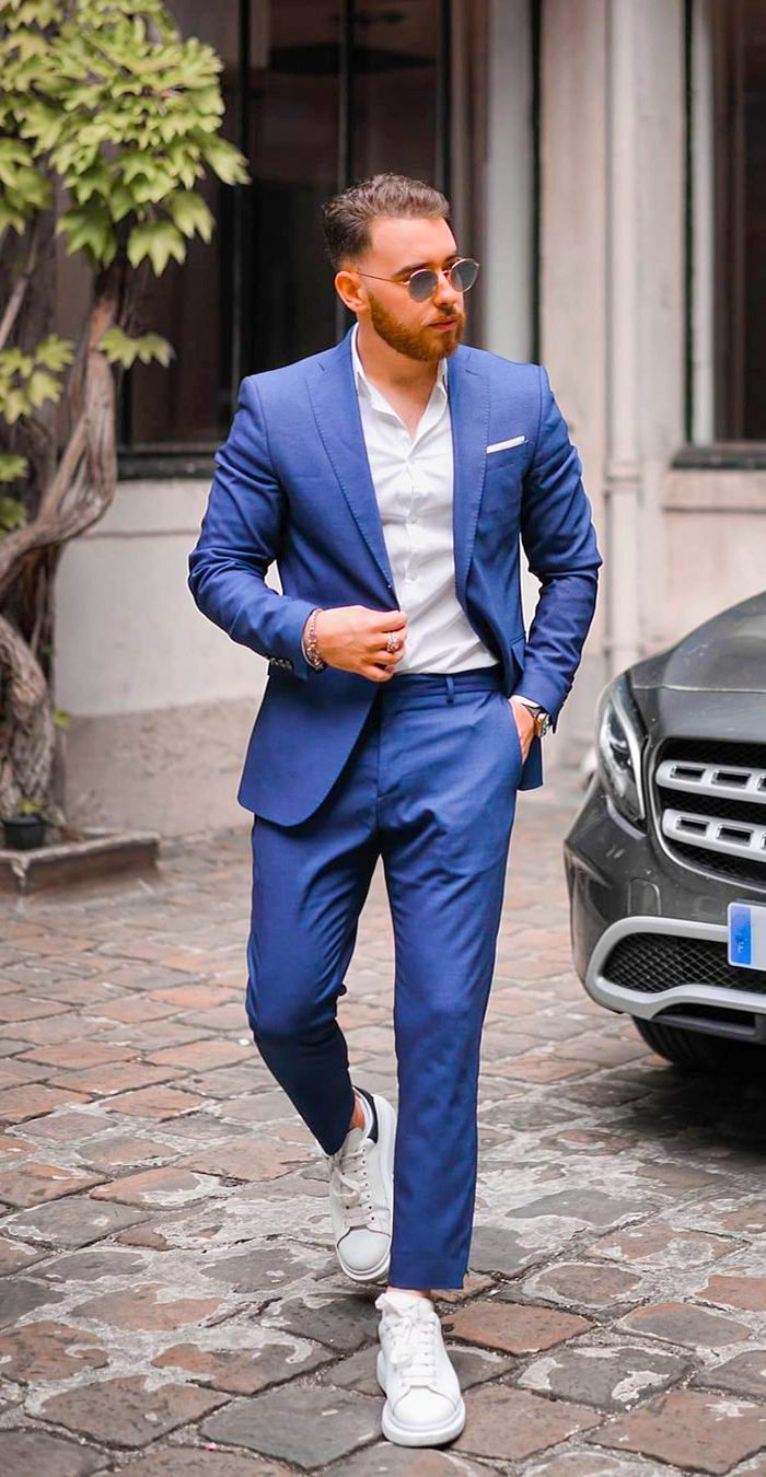 Blue suit, white dress shirt, white low-top sneakers outfit