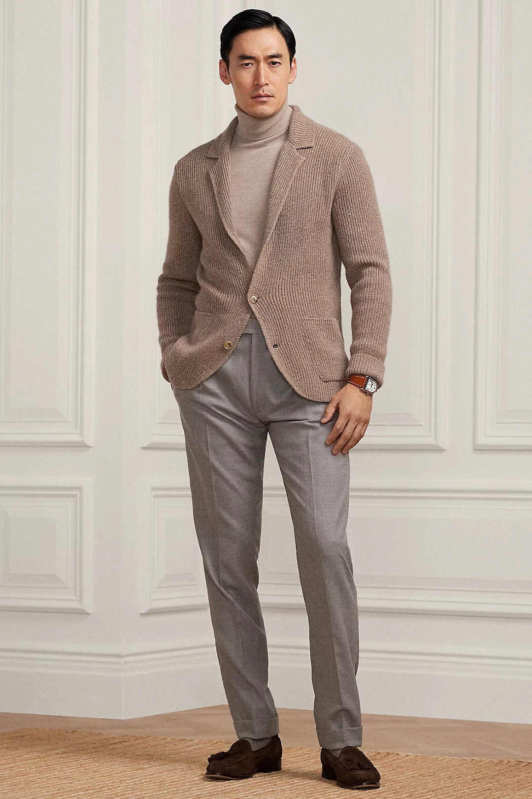Brown cardigan, light brown turtleneck, gray dress pants, and brown loafers outfit