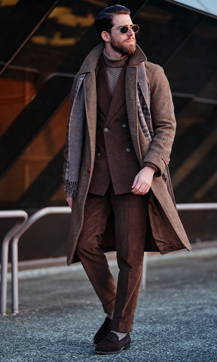Brown corduroy suit, brown overcoat, brown turtleneck, and dark brown suede loafers outfit