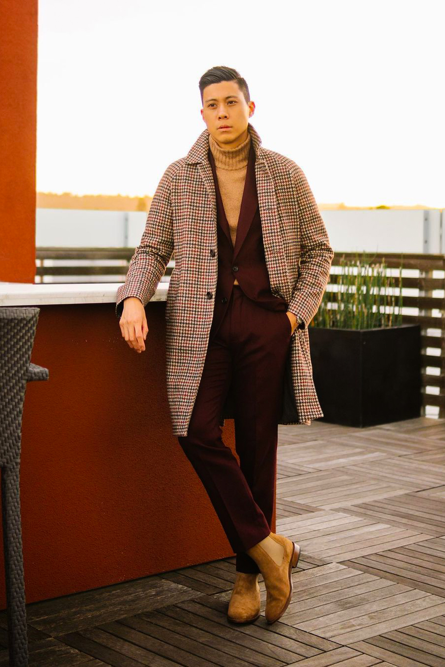Brown houndstooth overcoat, burgundy suit, tan wool turtleneck, Chelsea boots outfit