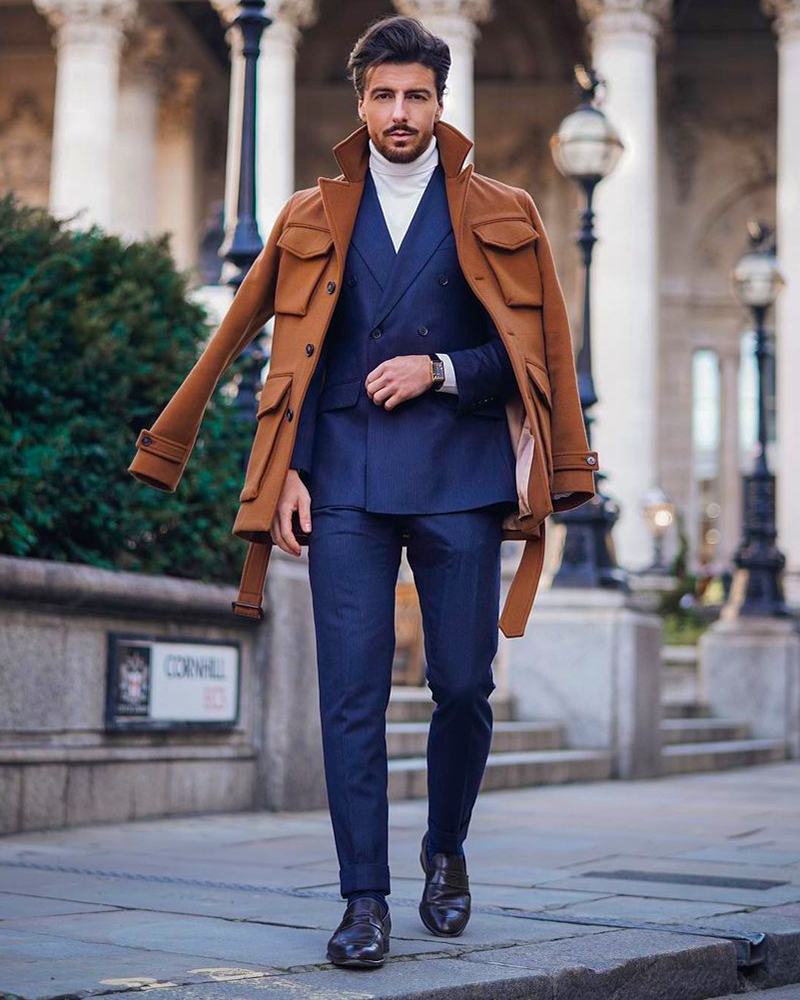 Brown pea coat, navy suit, turtleneck, and loafers outfit
