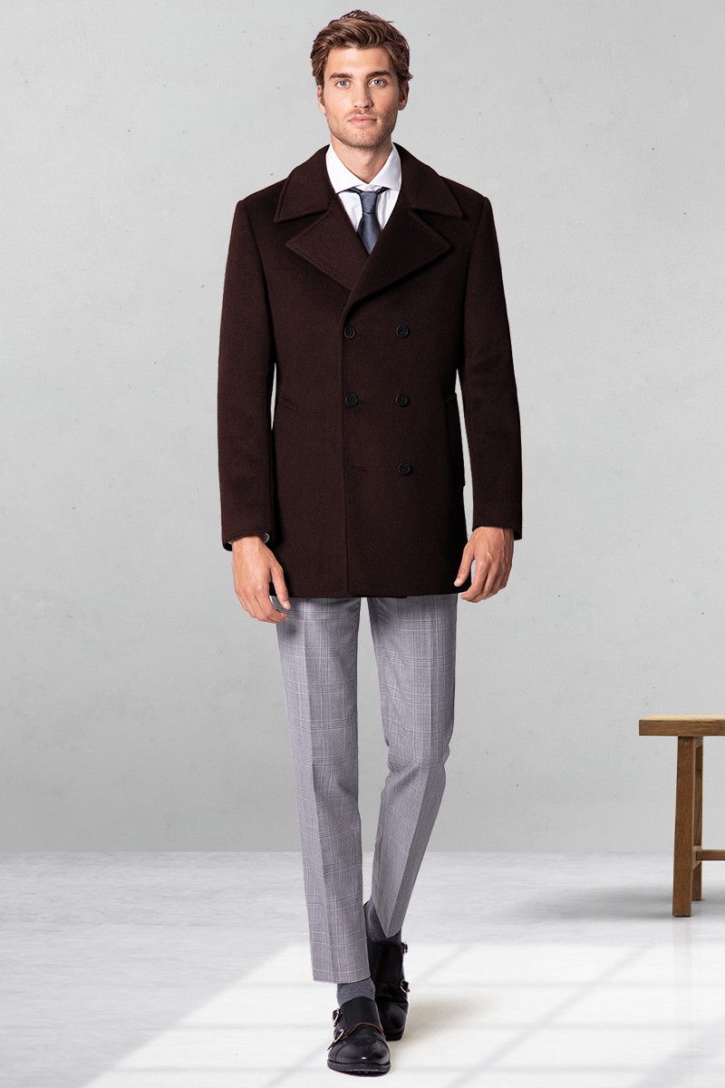 Brown pea coat, white dress shirt, blue tie, gray dress pants, and black monk straps outfit