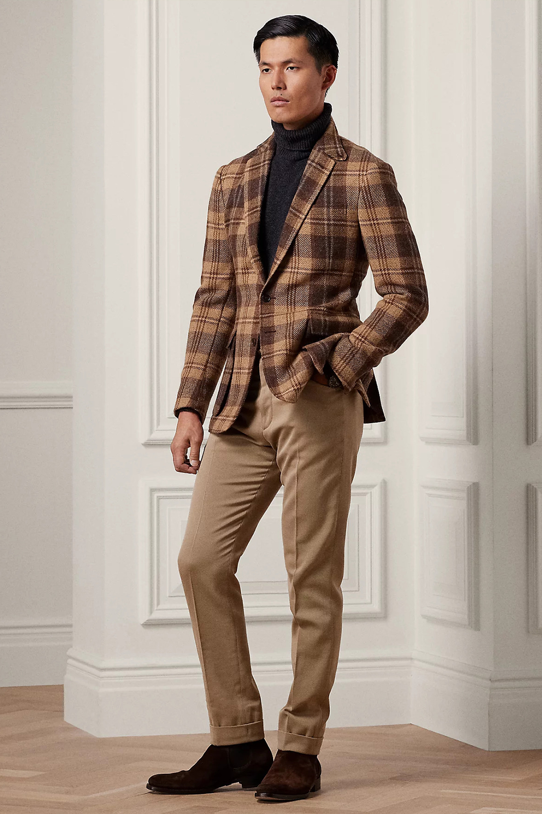 Brown plaid blazer, black turtleneck, tan chinos, and brown suede Chelsea boots outfit