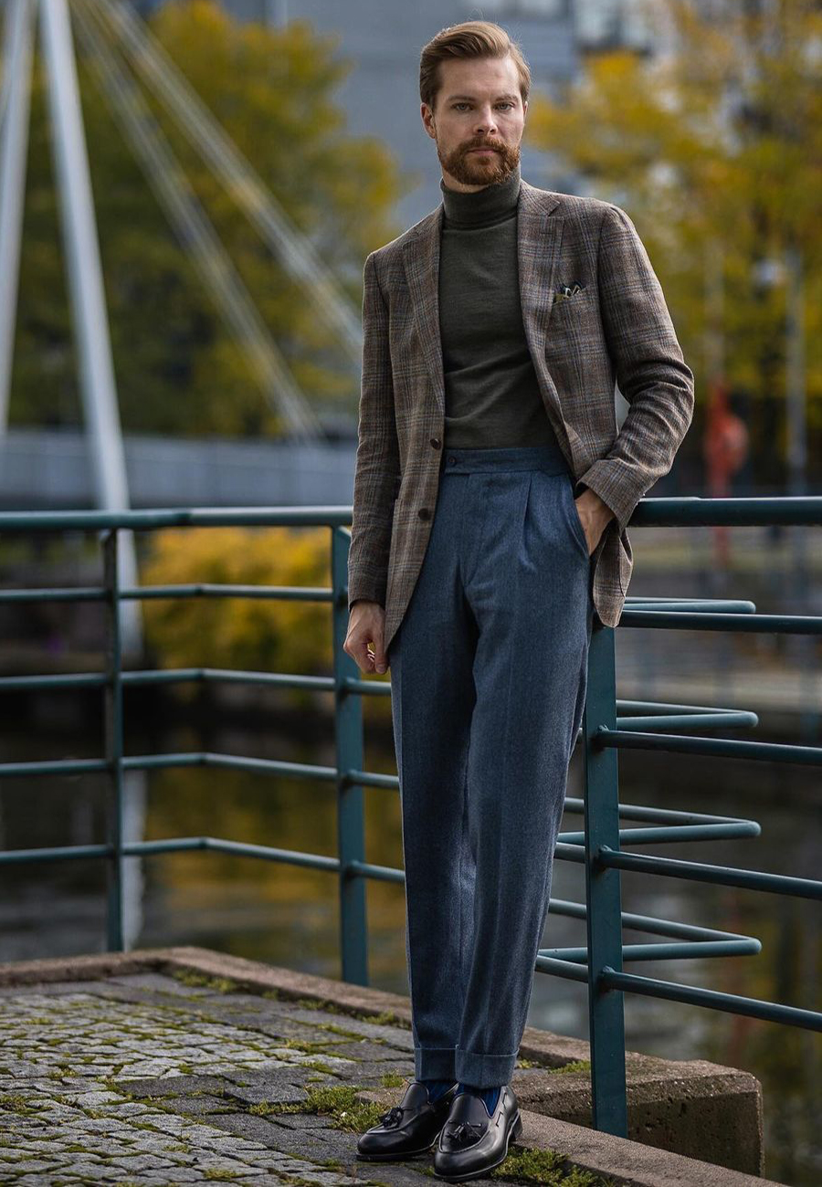 Brown plaid blazer, green turtleneck, blue dress pants, and black tassel loafers outfit