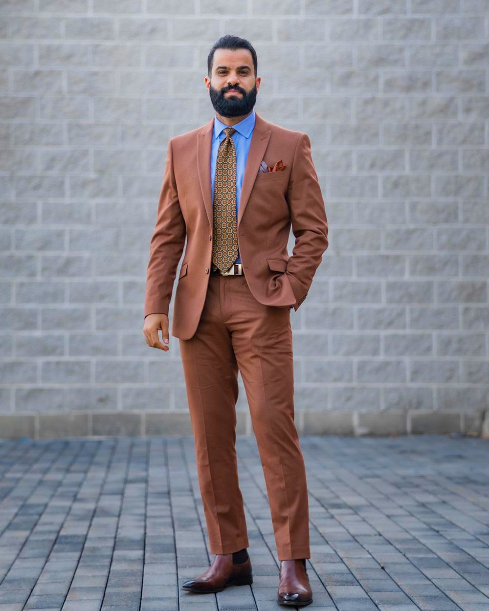 Brown suit with light blue shirt and Chelsea boots outfit