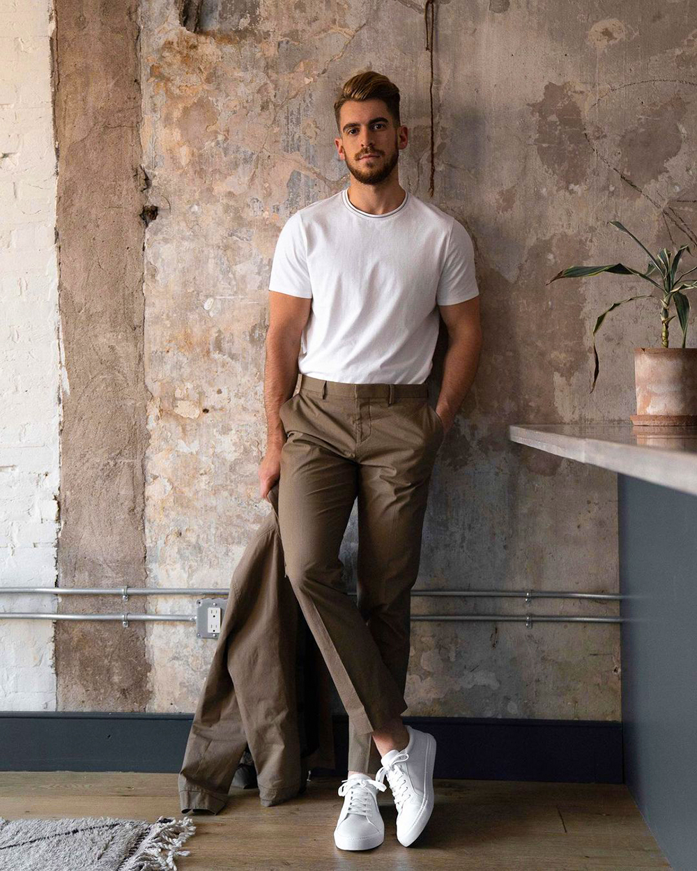 Brown suit, white crew neck t-shirt, and white canvas low-top sneakers outfit