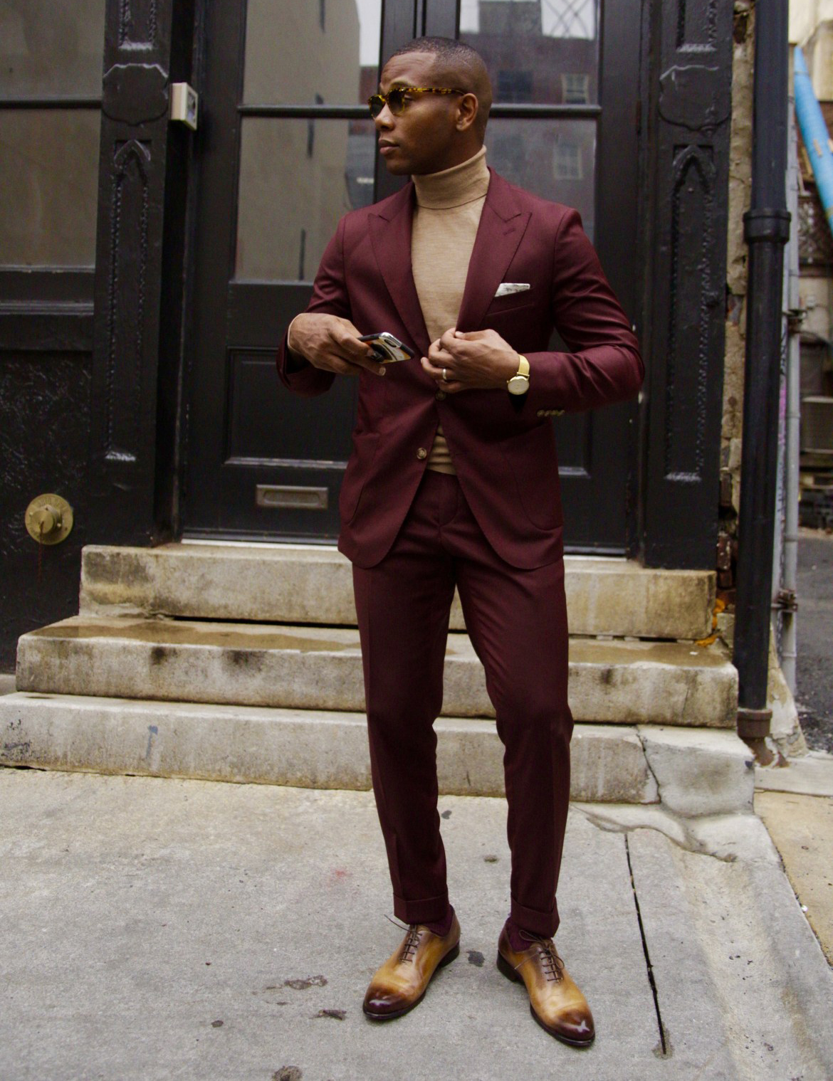 Burgundy suit, tan turtleneck, and brown shoes outfit