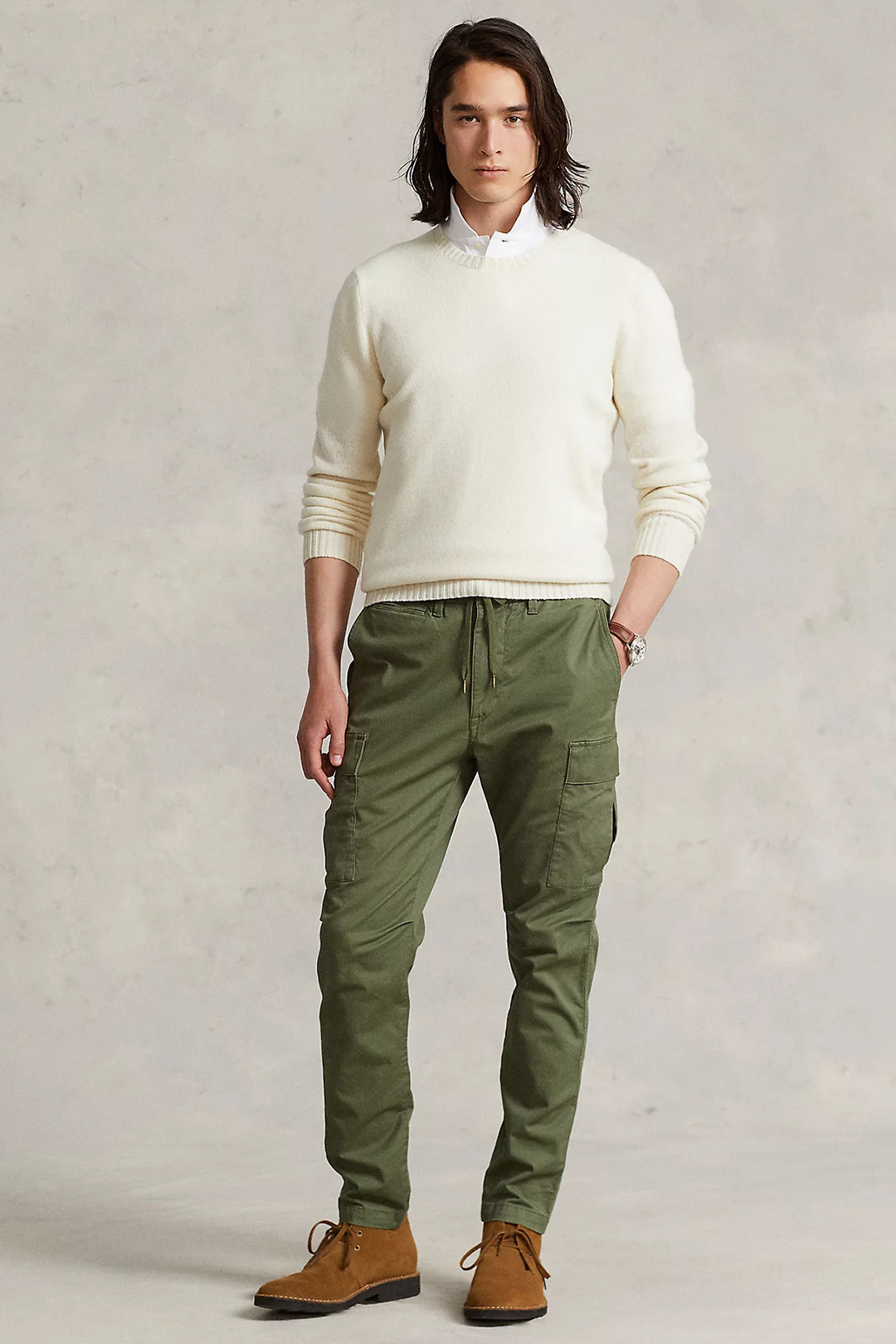 Cream sweater, white dress shirt, green cargo pants, and brown chukka boots outfit