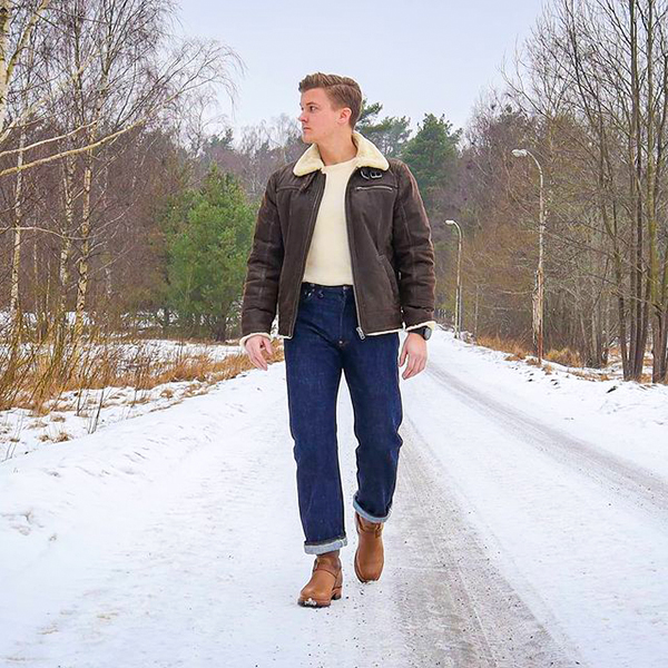 Dark brown shearling jacket, white crew neck t-shirt, navy jeans, brown leather Chelsea boots outfit