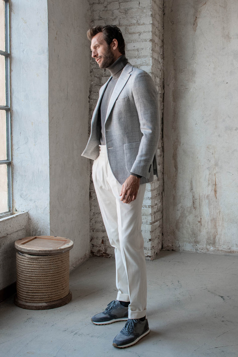 Gray check blazer, gray turtleneck, white cotton trousers, and gray suede runners outfit