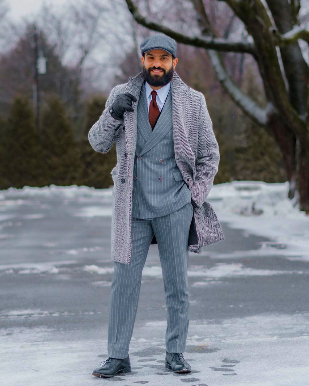 Gray herringbone overcoat, gray vertical striped wool suit, white dress shirt, black oxfords outfit