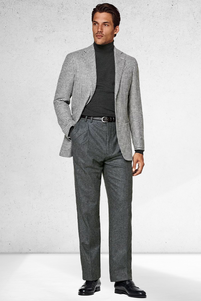 Gray houndstooth blazer, gray turtleneck, gray trousers, and black penny loafers outfit
