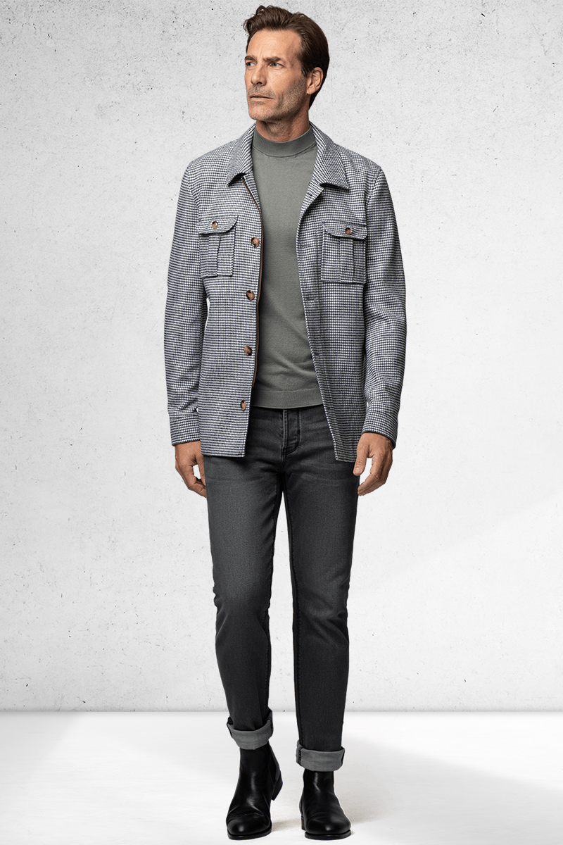 Gray overshirt, light gray turtleneck, charcoal denim jeans, and black leather Chelsea boots outfit