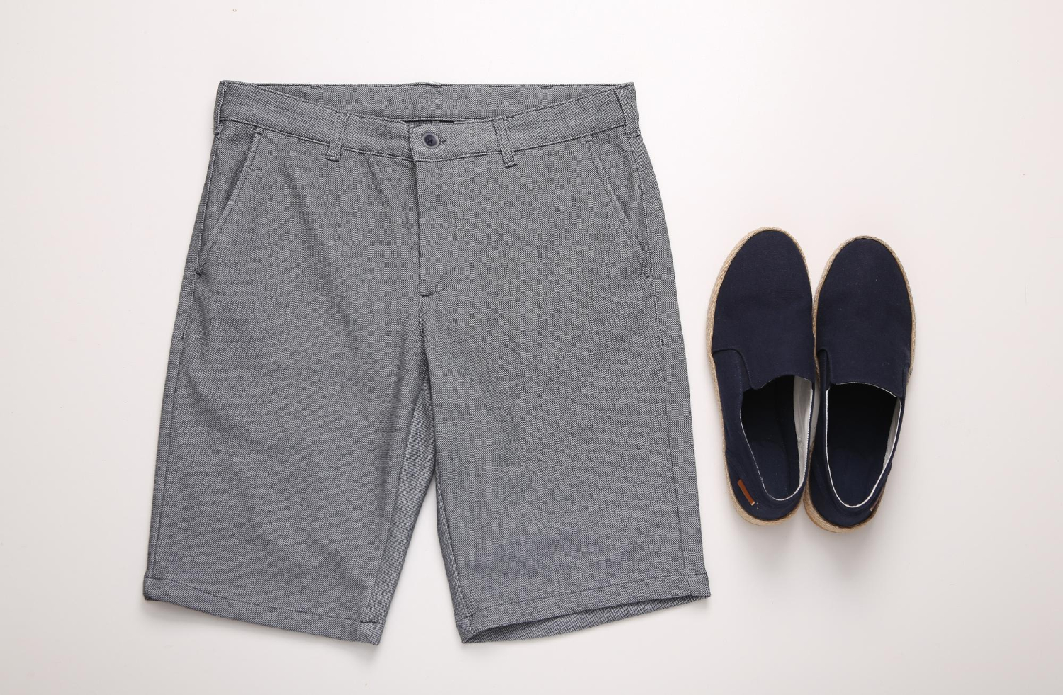 Gray shorts with summer navy slip-on shoes