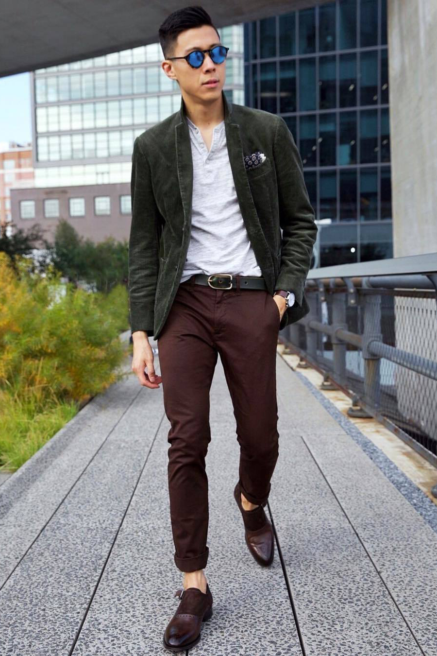 Green blazer, gray henley shirt, brown chinos, and brown monks outfit