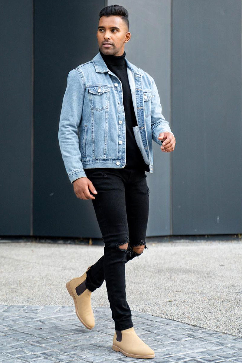 Light blue denim jacket, black turtleneck, black jeans, and beige suede Chelsea boots outfit