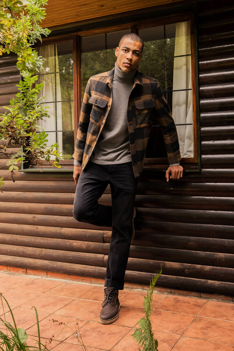 Lumberjack brown overshirt, gray turtleneck, black jeans, and brown casual boots outfit