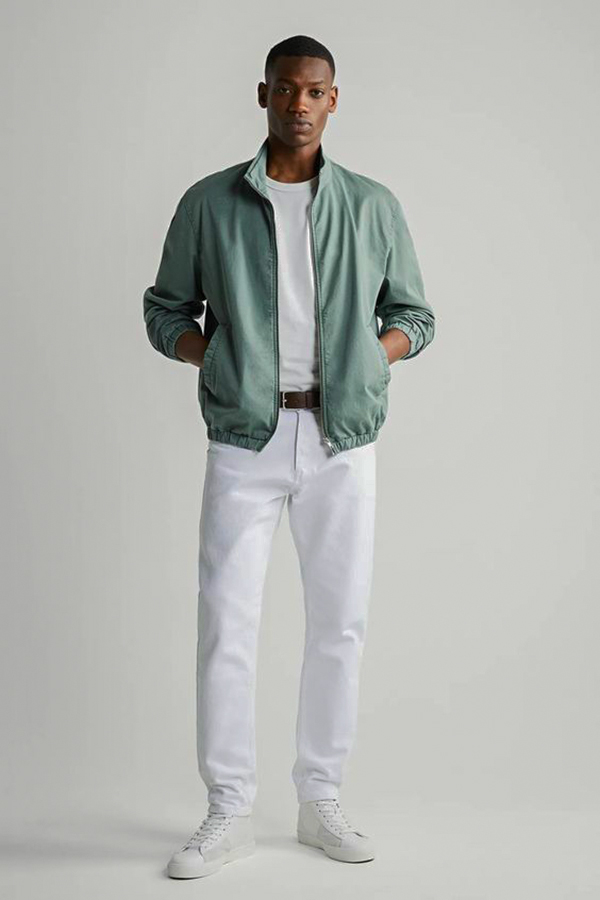 Mint bomber jacket, white crew neck t-shirt, white jeans, white low-top leather sneakers outfit