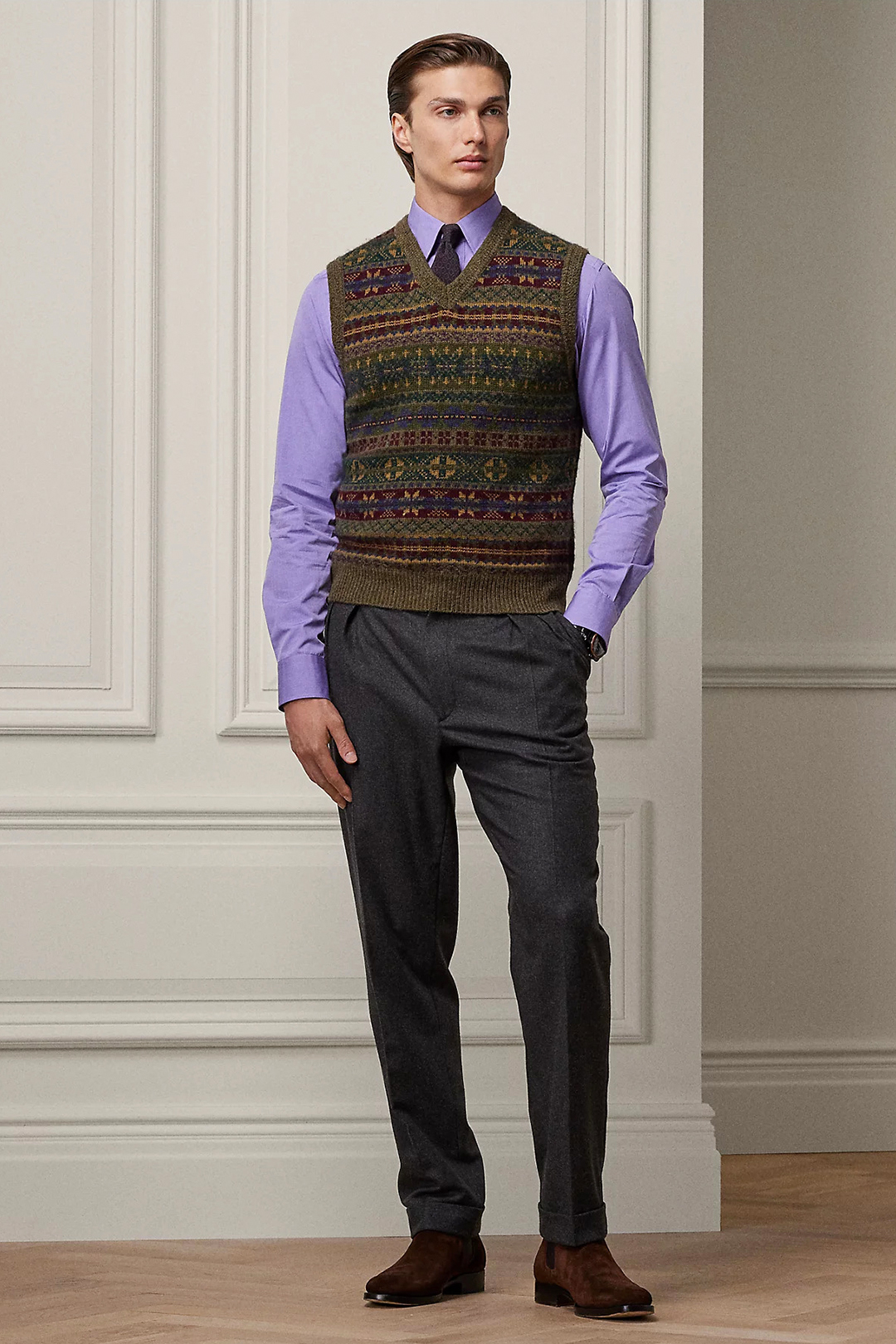 Multi-color sweater vest, violet dress shirt, violet tie, charcoal dress pants and brown suede Chelsea boots outfit
