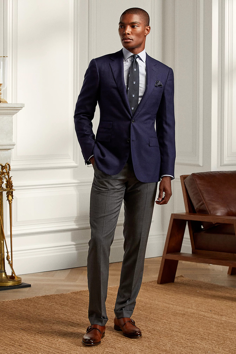 Navy blazer, white dress shirt, black tie, gray trousers, and brown monk strap shoes outfit
