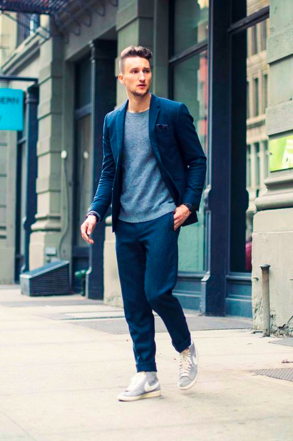 Navy blue wool suit, gray crew neck sweater, and gray shoes outfit