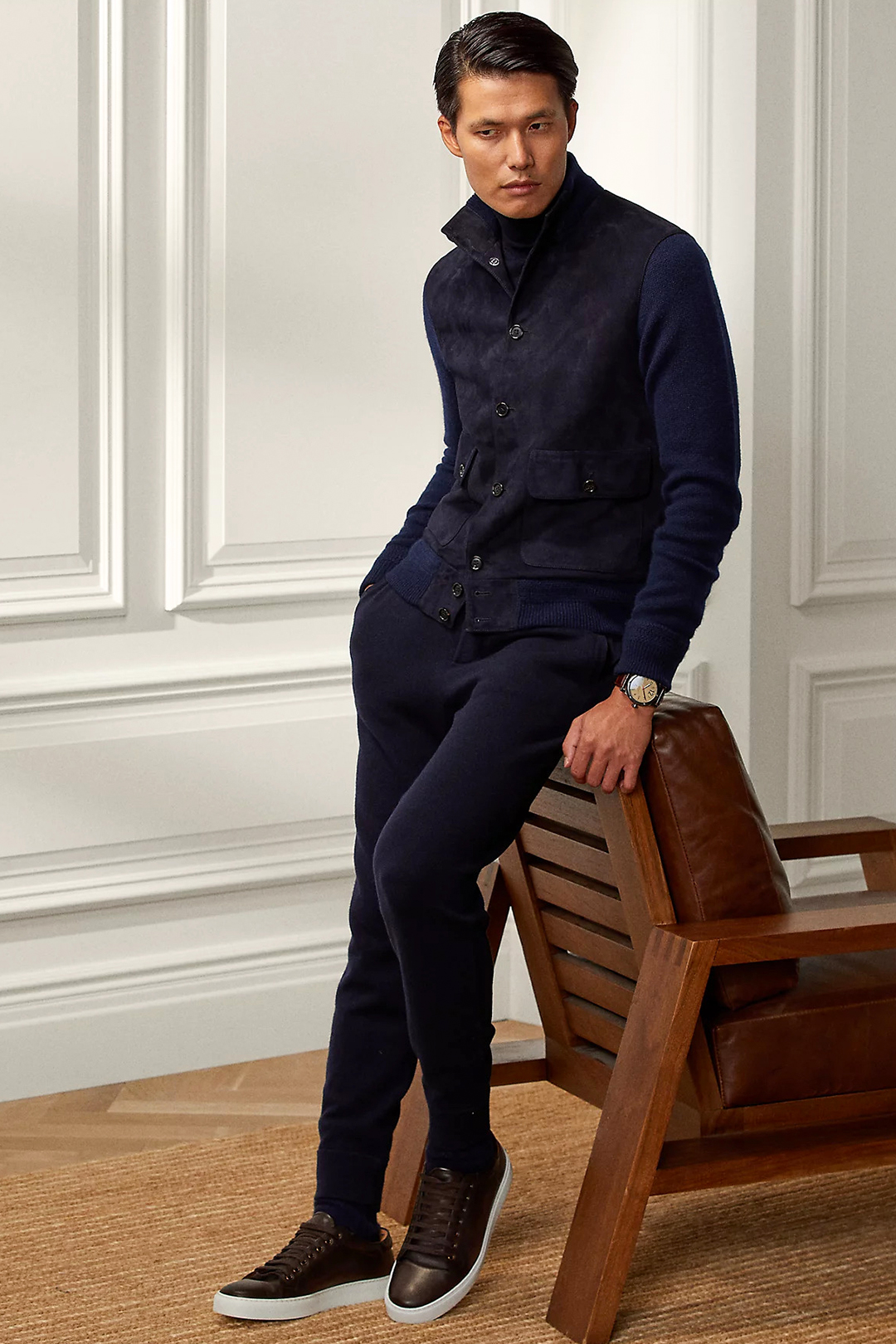 Navy cardigan, navy turtleneck, navy jogging pants, and brown leather sneakers outfit
