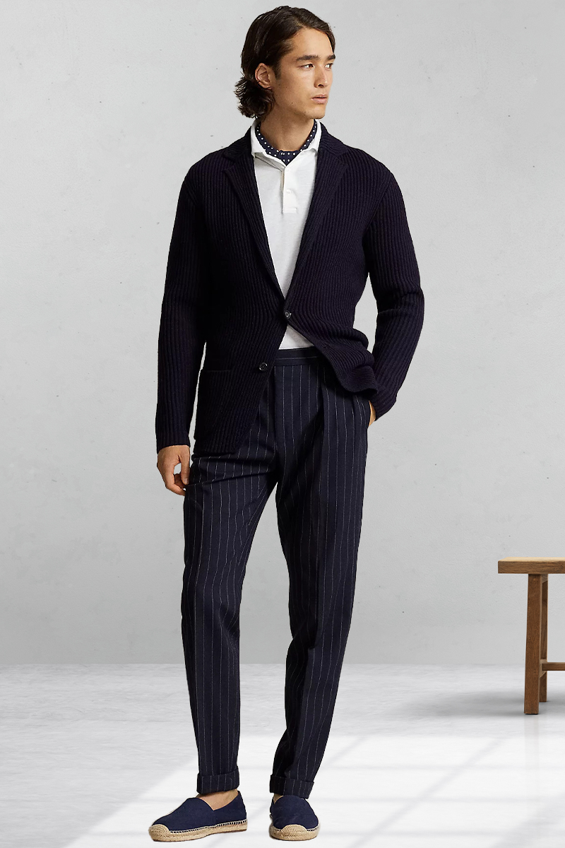Navy cardigan, white polo shirt, navy striped dress pants, and navy boat shoes outfit