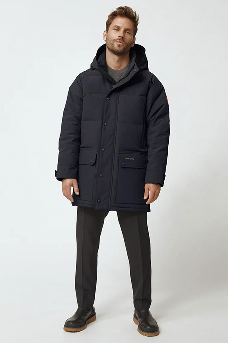 Navy parka jacket, gray trousers, and black puffer boots outfit