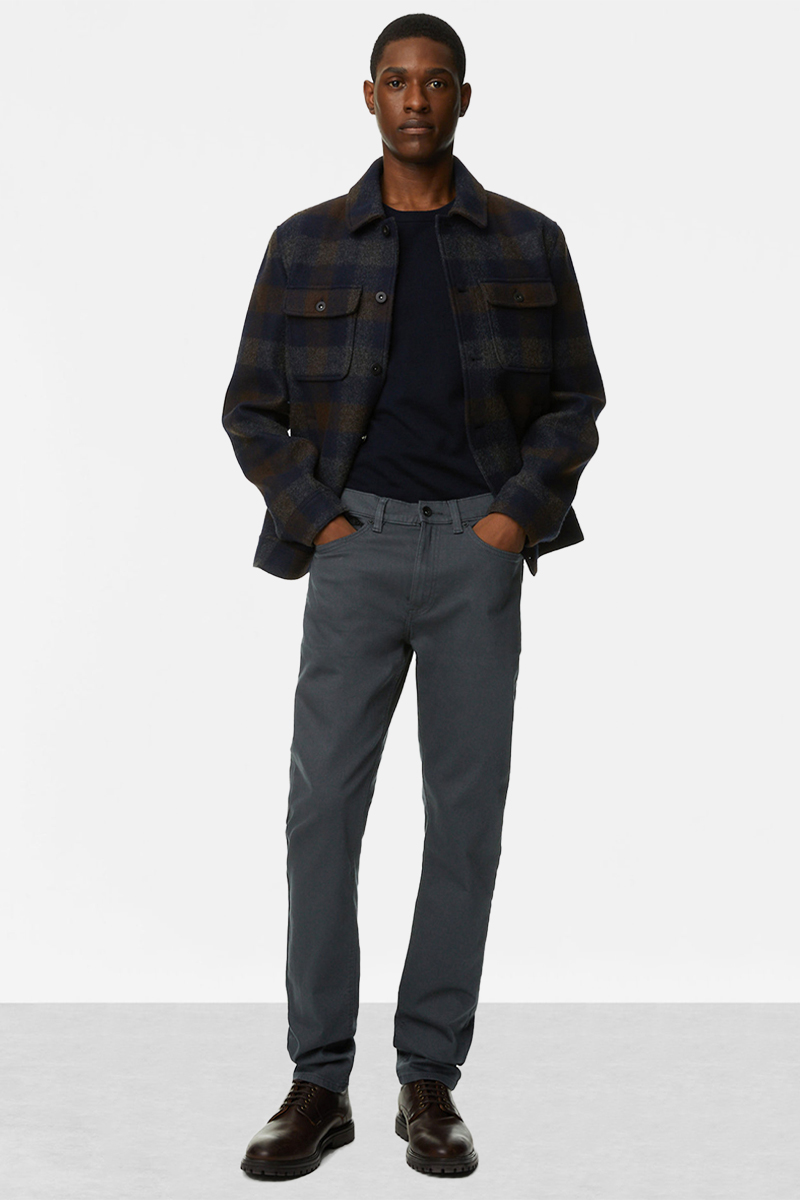 Navy plaid shacket, navy crew neck t-shirt, gray jeans, and brown lace-up boots outfit