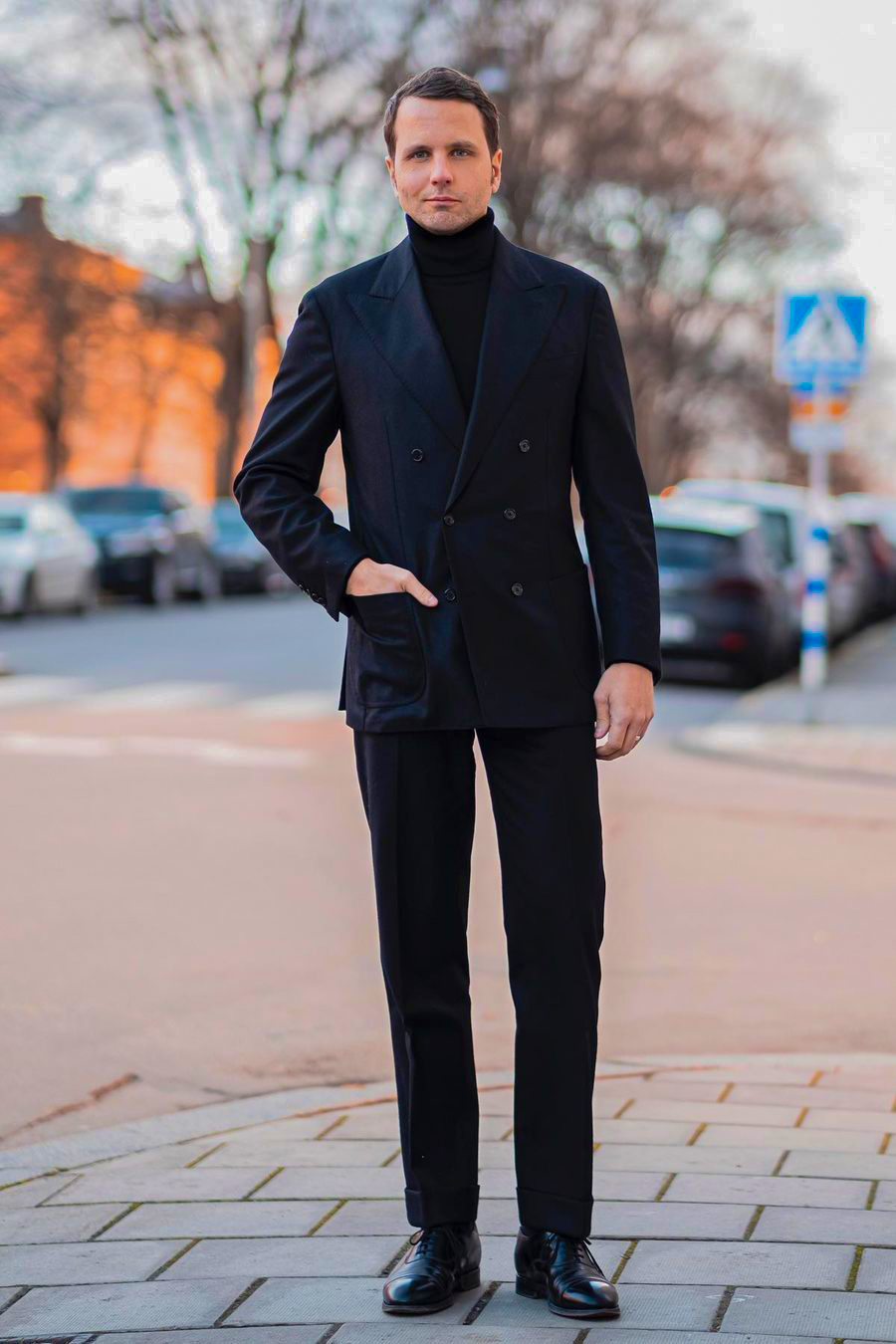 Navy suit, black turtleneck, and black oxford shoes outfit