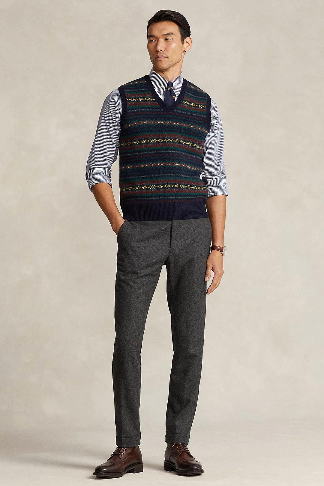 Navy sweater vest, blue shirt, navy tie, charcoal dress pants and dark brown dress boots outfit