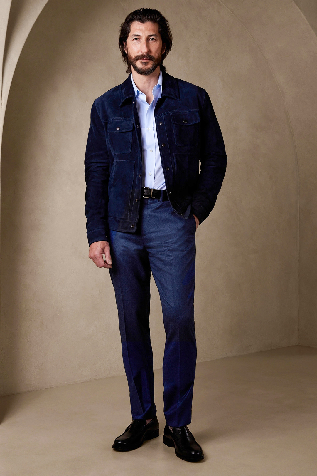 Navy trucker jacket, light blue dress shirt, navy dress pants, and black loafers outfit