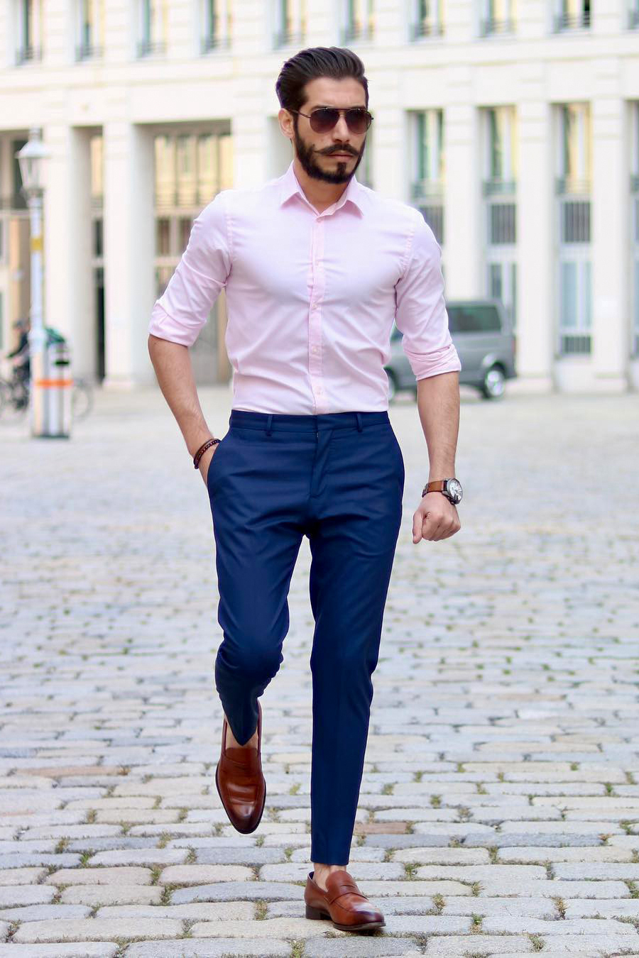 Pink dress shirt, navy pants, and brown loafers outfit