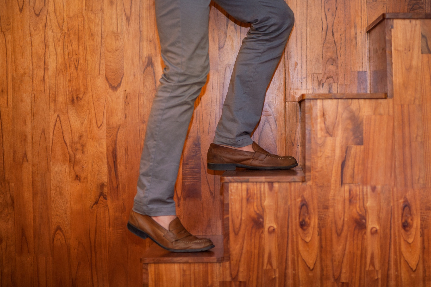 Sockless look with gray pants and brown loafers
