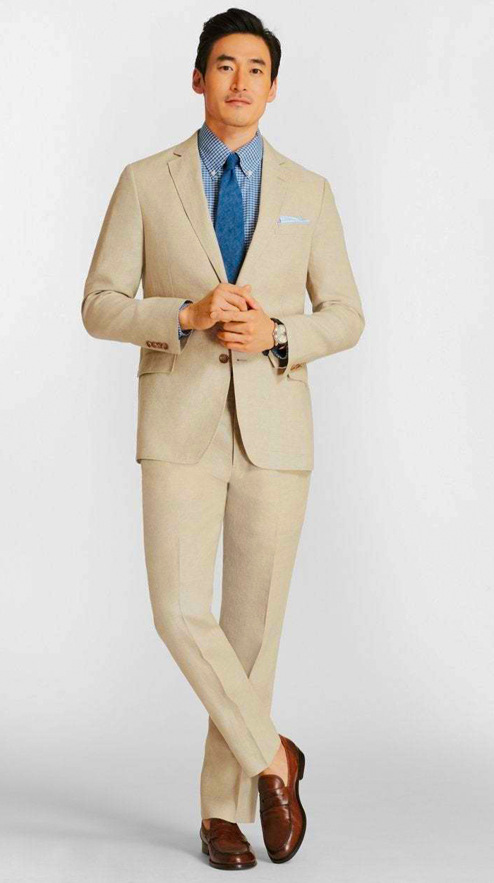Tan suit, blue dress shirt, brown loafers outfit