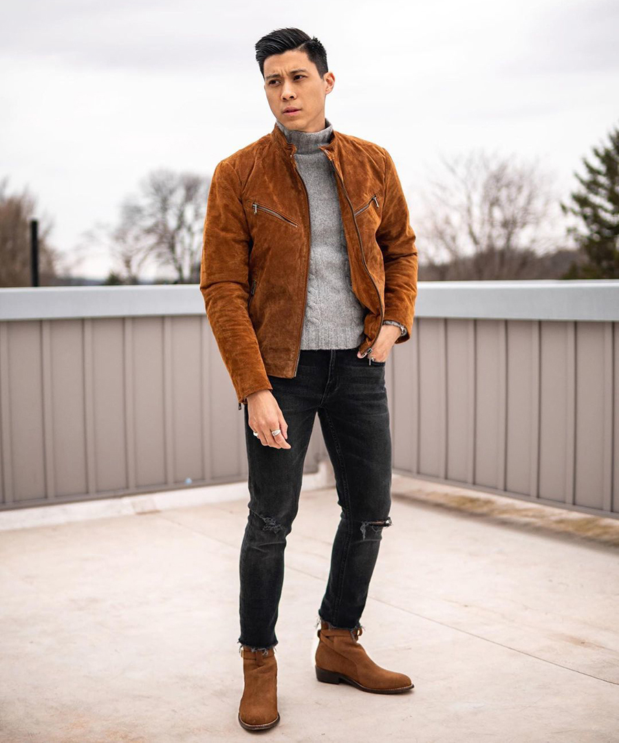 Tobacco bomber jacket, grey turtleneck, black skinny jeans, and brown suede Chelsea boots outfit