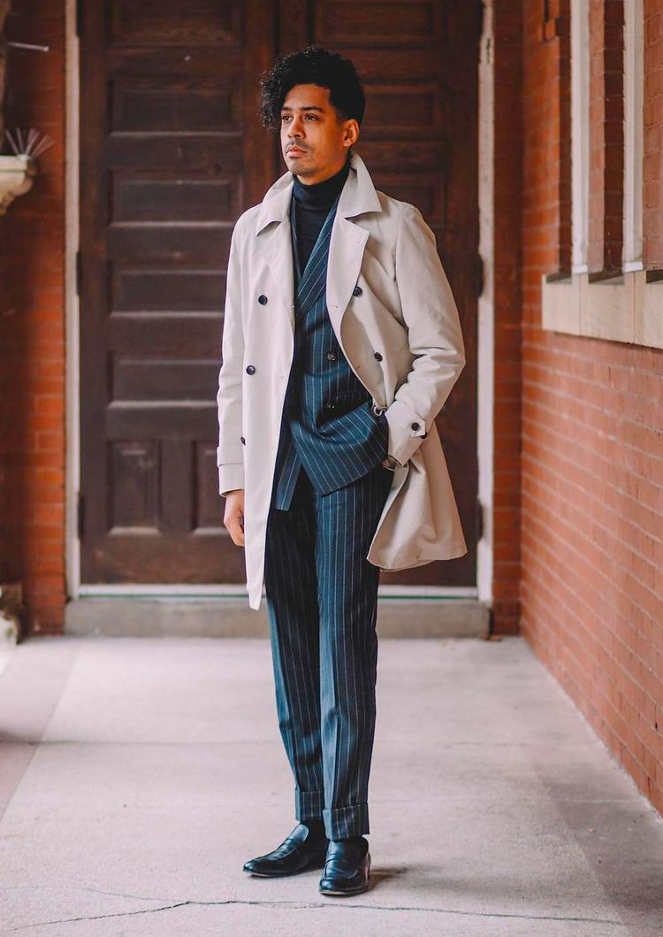 Beige trenchcoat with a vertical striped suit, turtleneck, and loafers outfit