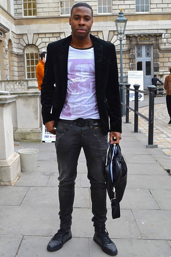 Wear a black blazer, white crew neck t-shirt, charcoal jeans, and black low-top sneakers