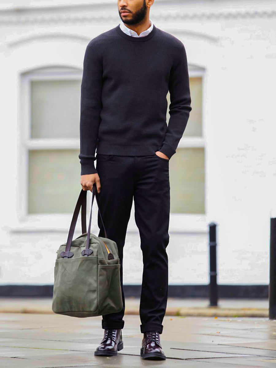 Wear a black crew neck knitted jumper, white shirt, black jeans, casual boots