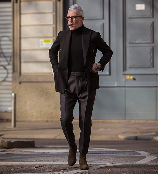 Wear a black suit with black turtleneck and brown Chelsea boots