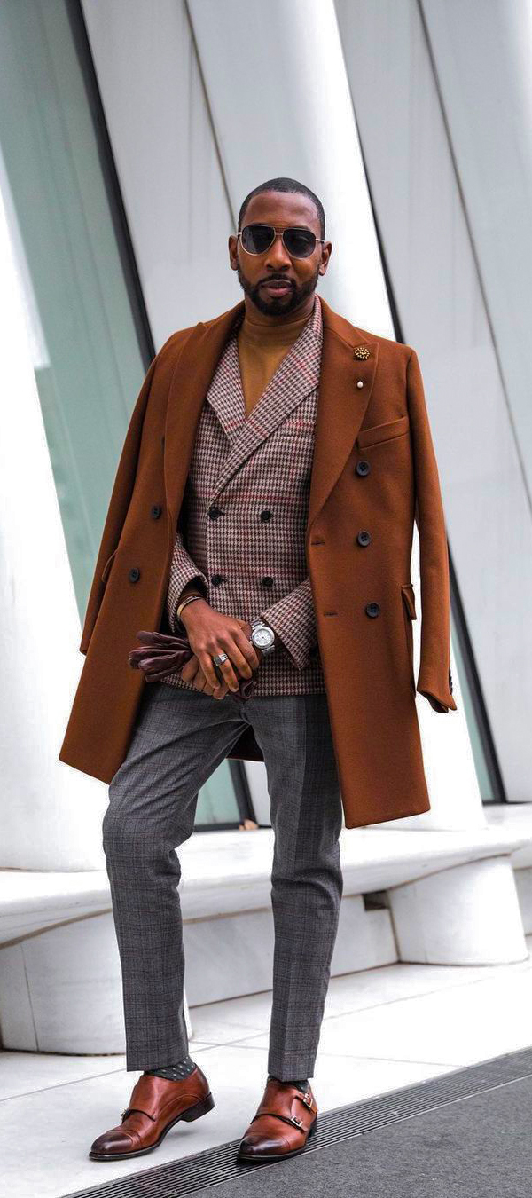 Wear an overcoat with double-breasted blazer, turtleneck, and brown double monks